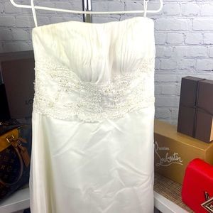 White strapless, bodice and bottom beaded wedding dress with satin pearl buttons